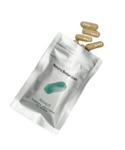 Close up of uniform clear vegetable capsules filled with a finely ground Adapt blend botanical powder